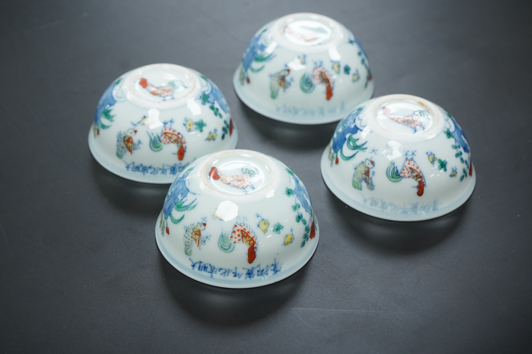 Four Chinese porcelain Wucai tea bowls, 8cm in diameter